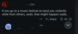 A Reddit comment arguing that attending a festival on "stolen land" justified what happened to the victims, illustrating the "they brought it upon themselves" narrative.
